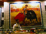 A large picture of a bull-fight painted onto tiles behind the bar of La Torre del Oro in Madrid.