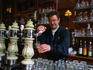 Pouring a Jupiler beer at the rustic Cafe aux Amis in Tournai