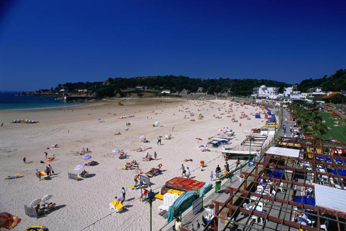 Sunbathing on the beach at St Brelade's Bay, Jersey