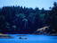 Canoeist paddling near shore in Sooke, just outside of Victoria City
