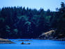 Canoeist paddling near shore in Sooke, just outside of Victoria City