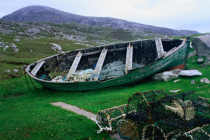 A disused fishing boat with lobster traps on Lewis Island ( Butt of Lewis ), Scotland