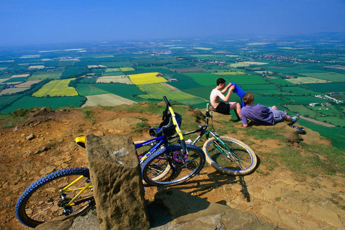 Resting and taking in the views over Vale of York from Kirby Bank, North York Moors National Park