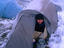 Ski tourer preparing evening meal, Winter in the Main Range, Kosciuszko National Park