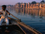 A young boatsman rows the sacred River Ganges in Varanasi.
