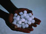 Spherical salt crystals, held in open hands