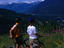 Commercial mountain bike tours from Whistler take tourists onto the high trails on Blackcomb Mountain, looking towards Whistler Mountain, British Columbia.