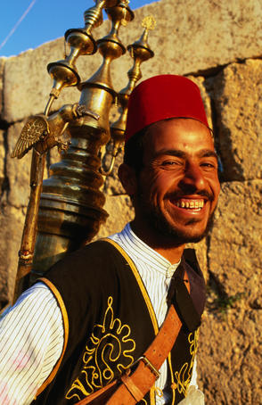 Portrait of smiling drinks vendor.
