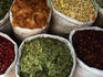 Bags of spices for sale at market.