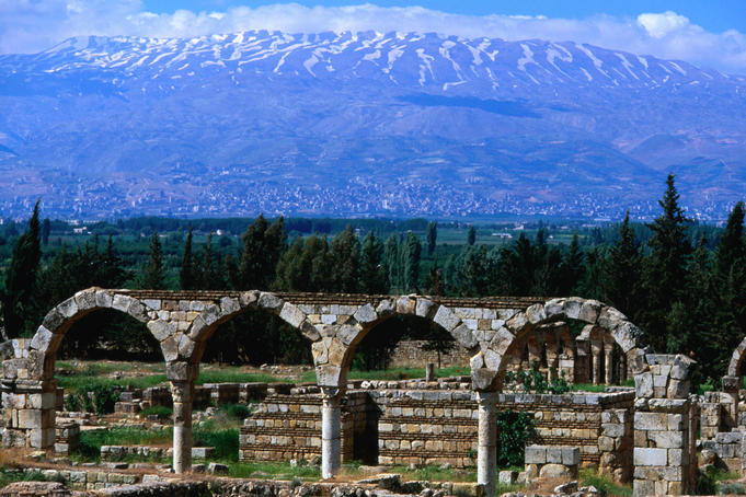 The significant Umayyad site of Aanjar: the mountain ranges behind archways and ruins