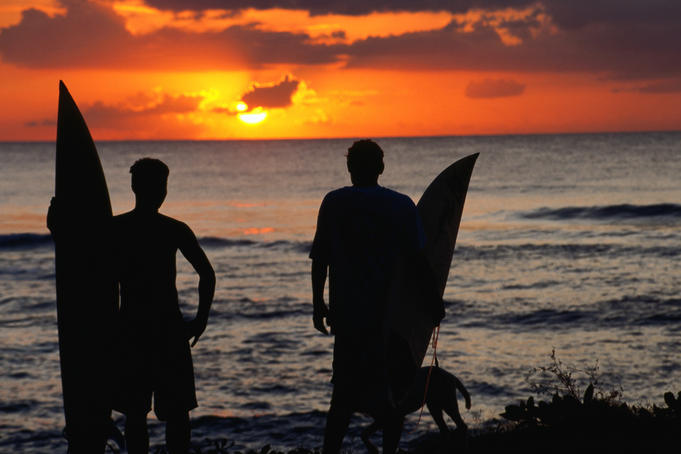 Surfers watch a Rincon sunset