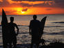 Surfers watch a Rincon sunset