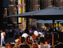 Patrons at an outdoor cafe in Stephansplatz, with the Gothic walls of St Stephen's Cathedral in the background