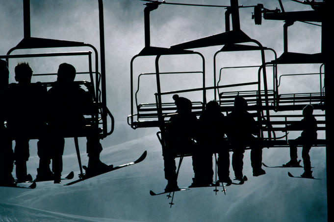 Ski lifts silhouetted.