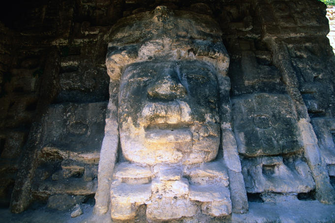 Detail of a stucco mask at Lamanai, structure N9-56, depicting a man in a crocodile-mouth headdress.
