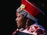 A Zulu lady wearing an isicholo, a wide hat decorated with beads (ubuhlalu) - Botanical Gardens.