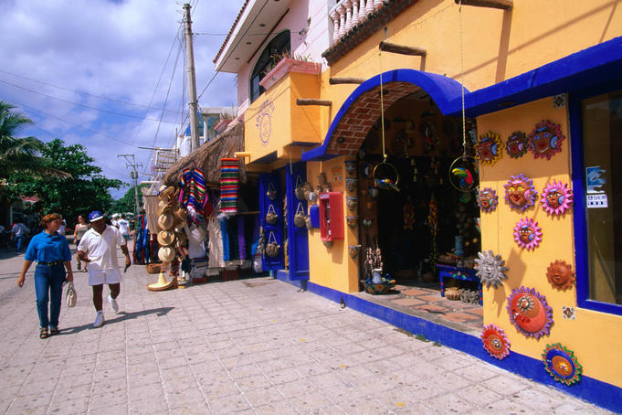 Street scene with tourist shops selling souvenirs and accessories.