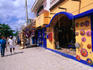 Street scene with tourist shops selling souvenirs and accessories.