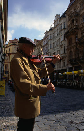 Violinist busking on the cobble-stone streets of Stare Mesto ( Old Town ), Prague
