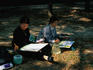 Two women paint watercolours. Seoul's parks are centres of social activity and creativity.