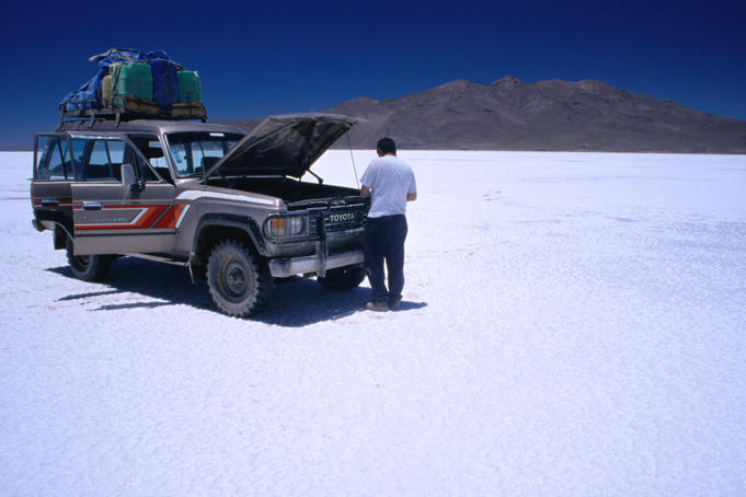 Four wheel drive vehicle on the Salar de Uyuni salt flat.