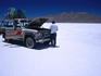 Four wheel drive vehicle on the Salar de Uyuni salt flat.
