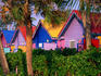 Very colourful huts in traditional Junkanoo colours, at Compass Point in Nassau.
