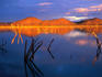 The Matuzviadonha Mountains caught in a blazing sunset, and reflected in the waters of slow river