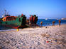 Stevedores from Pemba Island unloading sacks of cloves on Zanzibar Island's main beach. Cloves make up between 75 and 80% of the island's economy.