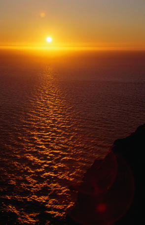 The midnight sun casts its glow over the Arctic Ocean, viewed from Nordkapp (North Cape), Europe's northernmost point.