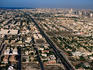Aerial view of the Abu Dhabi Highway cutting through the urban sprawl of Dubai