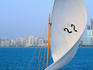 A racing Dhow enters the breakwater of the Corniche - Abu Dhabi