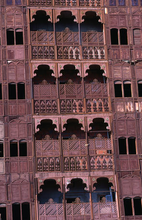Traditional balconies and decorative facade in old town.