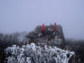 People praying at the snowy Cheonjedan Altar on Taebaeksan mountain, which means 'Big White mountain'. The mountain is one of three sacred peaks to Korean Shamanists.
