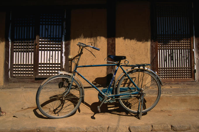 Bicycle outside a traditional mud house in the Hahoe Folk village, a genuine historical village living much as they did in the 16th century.