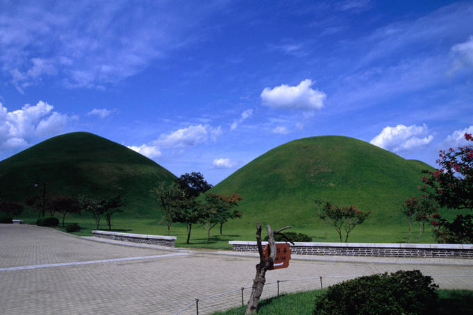 View of the tomb mounds in Tumuli Park in the heart of Gyeongju (Kyongju). There are twenty tombs of the Silla monarchs and family within the walled area.