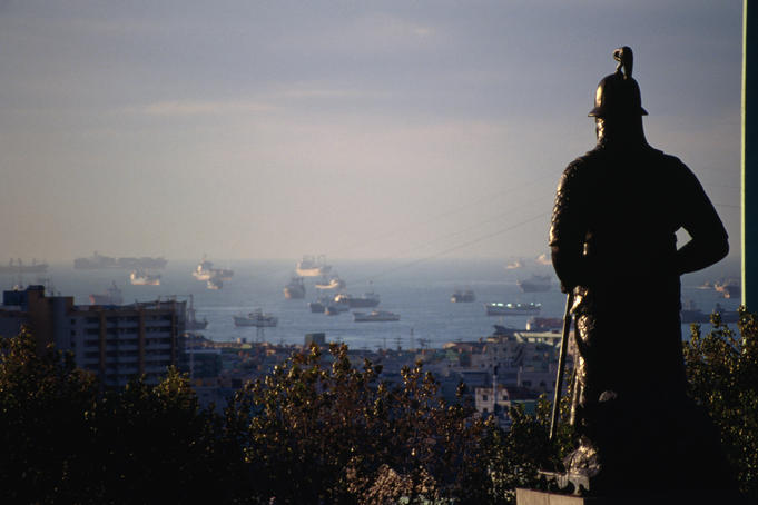 Admiral Yi's bronze statue protectively gazes over the Busan (Pusan) harbour, South Korea's busiest port.