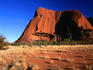 Light and shadow reveal the south-west flank of Uluru (Ayers Rock) from the path to Mutitjulu Gorge. The rock rises to a height of 348 metres above the surrounding plain and is the centrepiece of the Uluru-Kata Tjuta National Park.