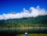 Buttle Lake at early morning with a blue canoe in the foreground, Ralph River Campsite.