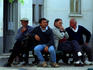 Alvor menfolk contemplate the passing of the afternoon in the town centre.