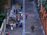 People walking up the 406 steps of the Montagne de Bueren.