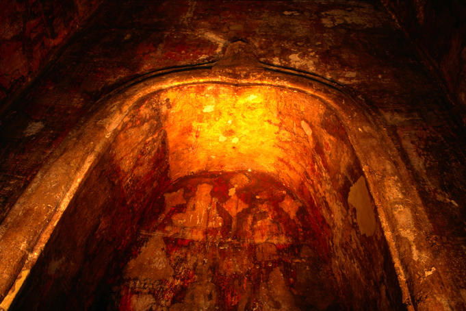Ancient murals can be seen outlined on the walls of this secret crypt, at Wat Ratburana, built by King Boromrachthirat II as a cremation site for his two elder brothers