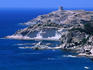 The rugged coastline of Costa del Sud with a Spanish tower perched high on a cliff