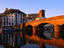 Pontevecchio bridge reflected in the River Temo with Castella Malaspina (castle) above the town, Bosa, Sardinia
