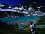 A hiker takes a rest on the shores of Wedgemount Lake in the Garibaldi Provincial Park.