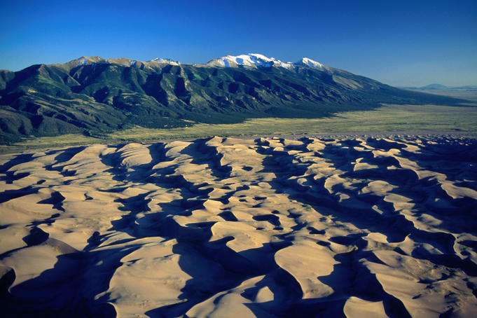 Sand dunes and Sangre de Cristo Mountains in the Rocky Mountains.