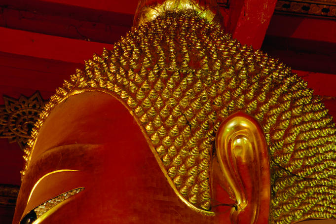 The very top half of Buddha. In the Ayuthaya Historical Park, Wat Mongkhon Bophit contains one of the largest images of Buddha in Thailand.