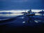Fishing boat plowing through calm waters outside of Lofoten.