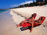Couple sunbathing on shore of Playa Ancon.