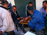 A group of men playing a game of backgammon in Psiri, Athens